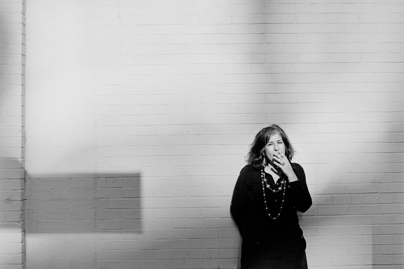 Black and white portrait of Iranian Artist Samira Abbassy in Chelsea NYC Portrait UK Ex-Pat Artist Samira Abbassy on Streets Chelsea High Line Park
