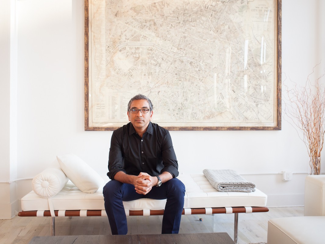 Corporate Portraits CEO Headshots NYC Modern Portraits Photography NYC Portrait of architect, urbanist, author, and Columbia University associate professor Vishaan Chakrabarti at his home in Manhattan. Map of Paris hanging on wall behind. New York, NY