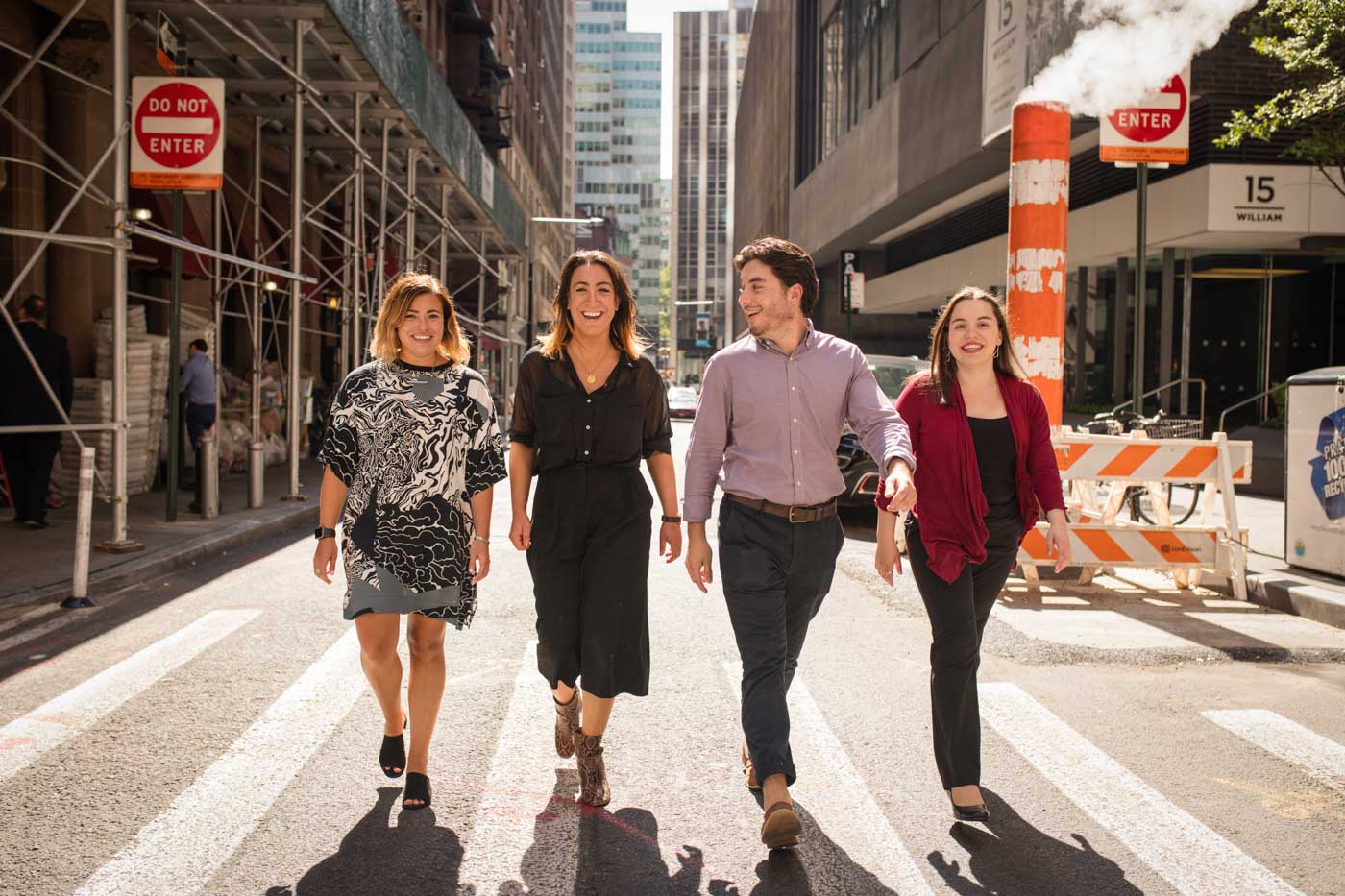 Fun team portraits of NYC creative marketing agency walking on streets of lower Manhattan