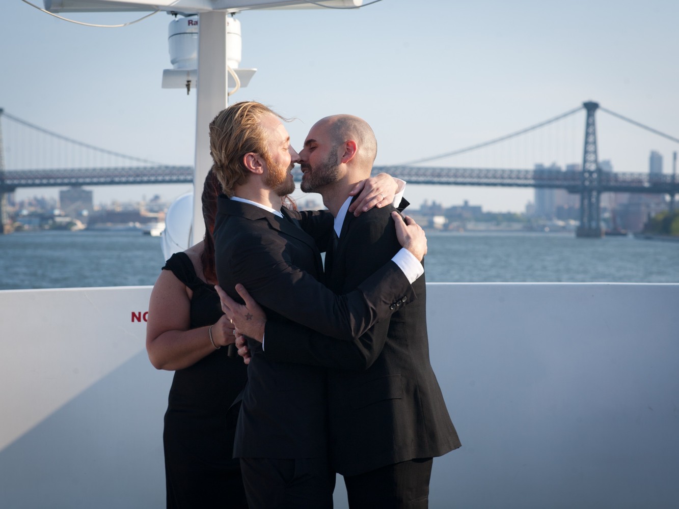 Gay couple have upscale wedding on yacht sailing around Hudson River NYC.