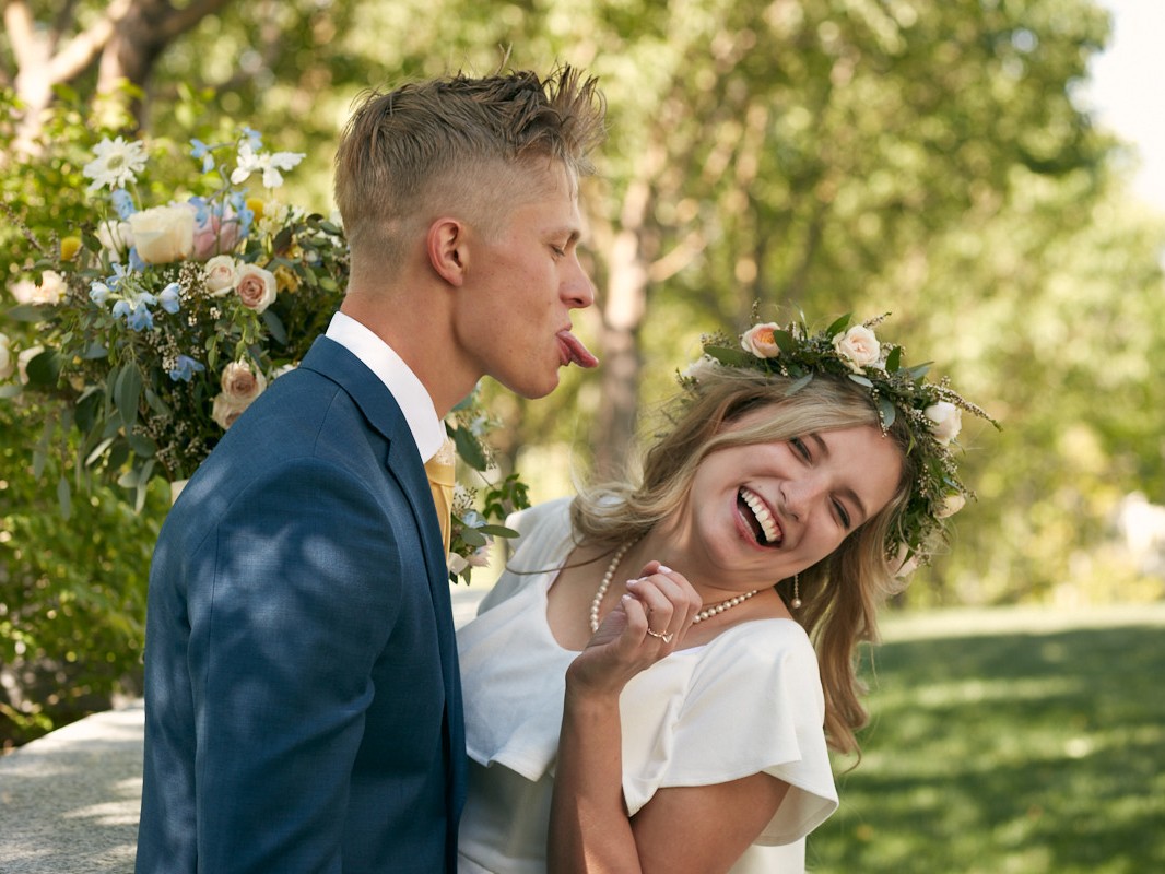 Young LDS couple kiss after being married in a Mormon temple Utah