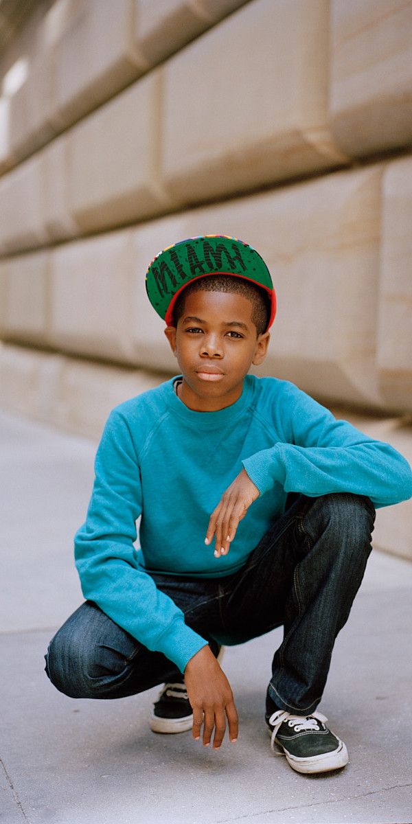 Portrait of Young Black Boy in Cap On Street - Dallas Portrait Photographer