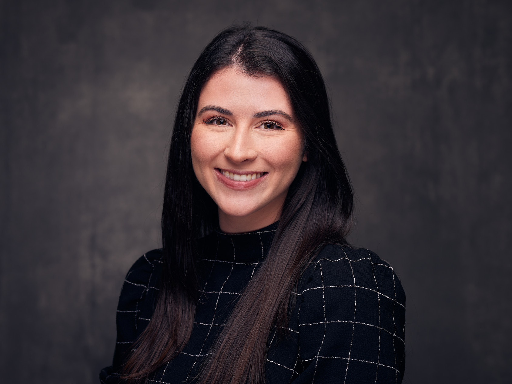 12 Tips to Ensure Your Team Nails Their Corporate Headshots in Dallas - Young Business Woman Headshot