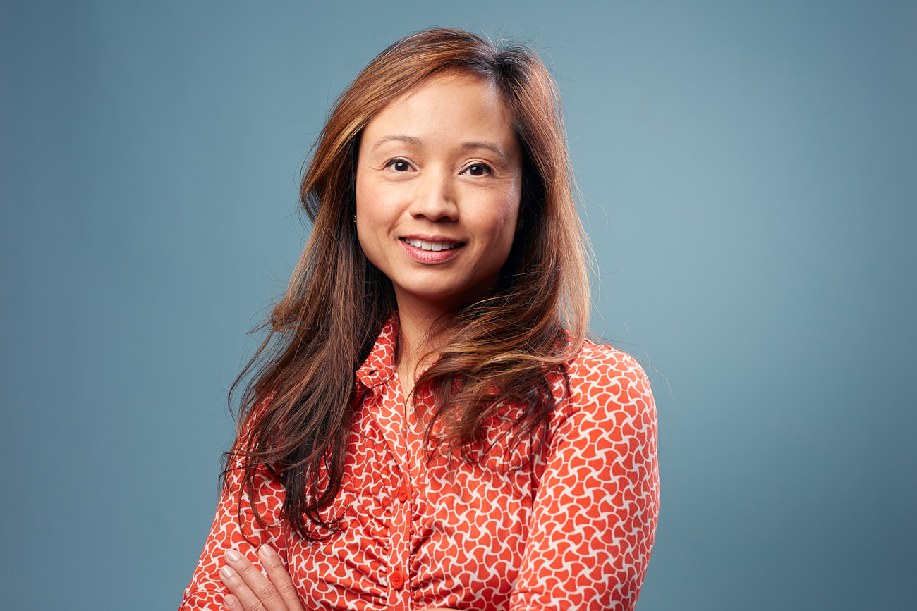 Benefits of Regularly Refreshing Corporate Headshots - Colorful Headshot of Asian Woman