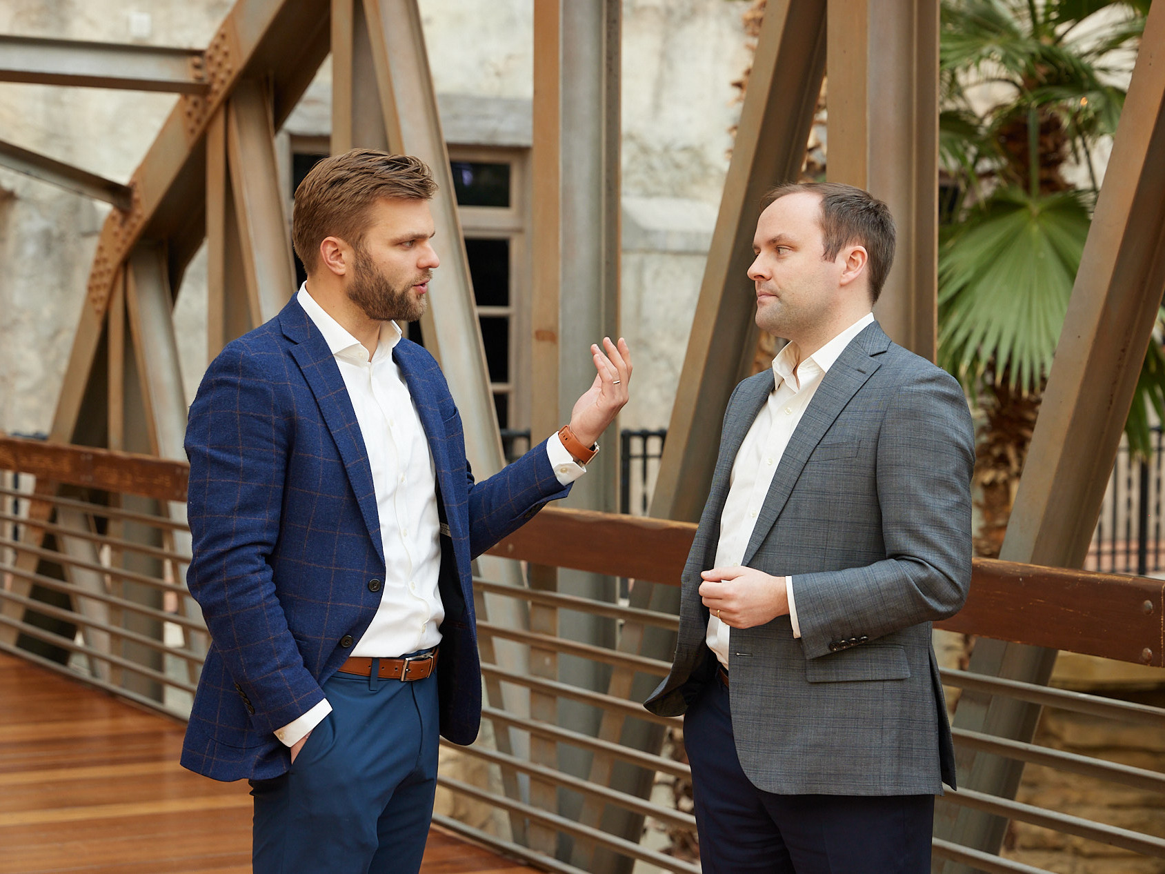 The Power of Authenticity in Corporate Lifestyle Photography - Executive Engage in Casual Dialogue During Annual Meeting